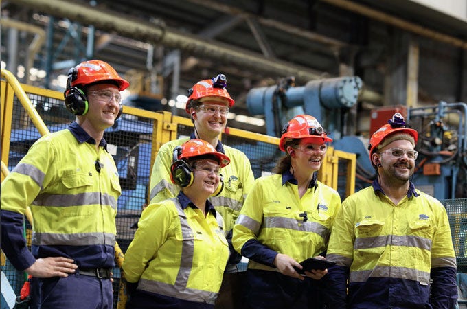 A group of BlueScope employees in PPE clothing